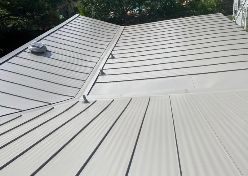 Solar attic fan installed on a metal roof for Roof Ventilation in Lebanon